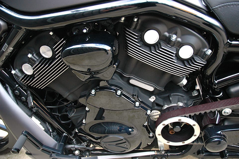 Black and polished metal V-Rod engine with visible drive belt